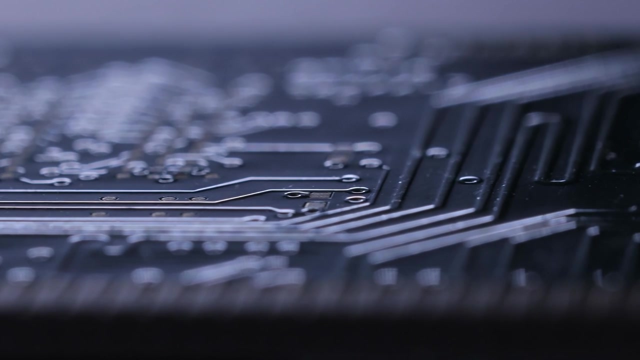 Eletronic circuits board with gold conectors. PCB board macro video with back light.