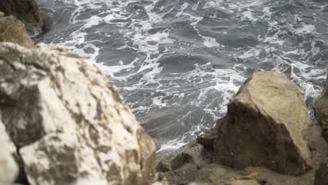 waves crashing against rocks on the coast