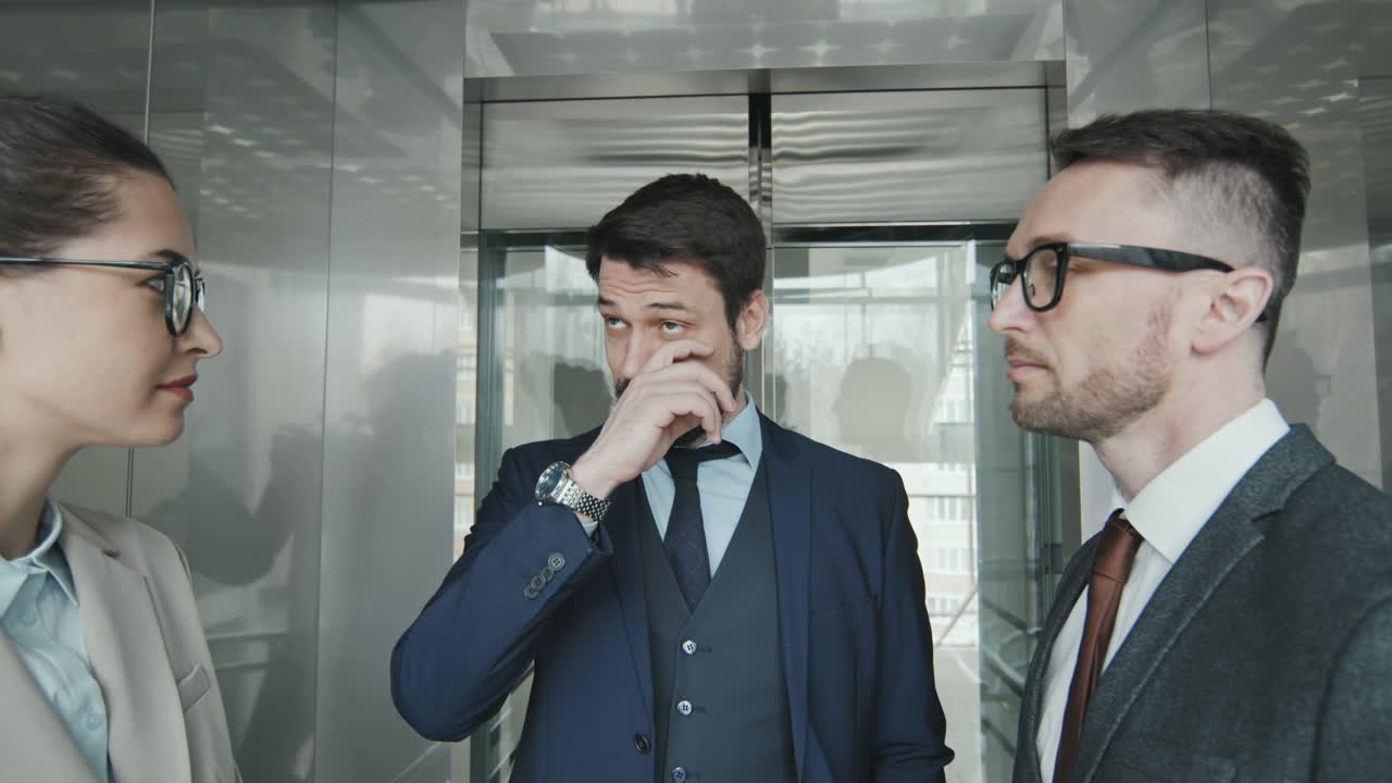 Team of Lawyers Walking into Elevator in Office