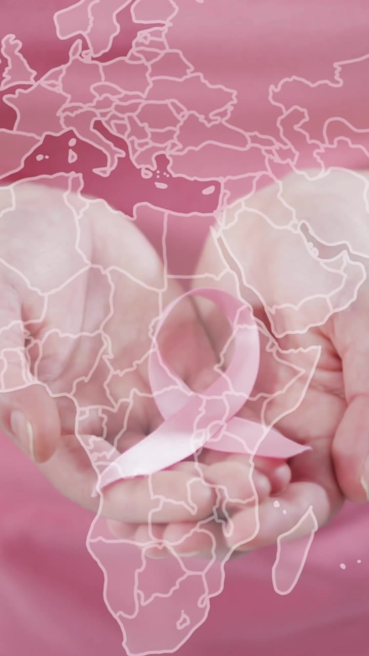 Animazione di mappa del mondo su donna caucasica con nastro rosa su sfondo rosa