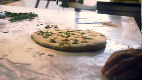 male chef preparing pizza in commercial kitchen 4k