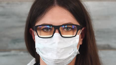 woman doctor wearing face mask and glasses