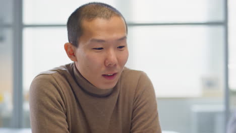asian man having consultation with doctor