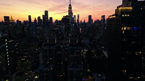 Darkness-of-night,-New-York-cityscape-illuminated-by-golden-hour-sky