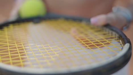 female tennis player practicing serve on outdoor court