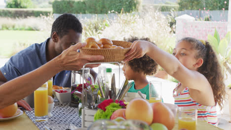 video of diverse family spending time together and having dinner outside