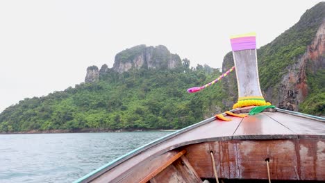 tour boat navigating past lush, rocky islands