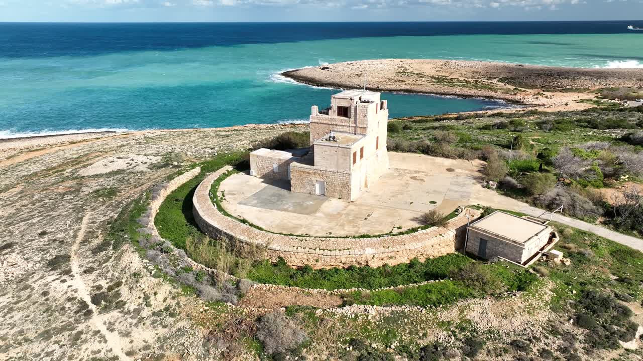 Drone Video Flying Upwards Looking Down at the It-Torri-Abjad on Malta