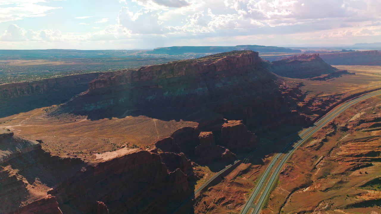 Amazing rocks in the rays of bright summer sun. Panoramic view of magnificent canyons and deserts in Utah, USA.