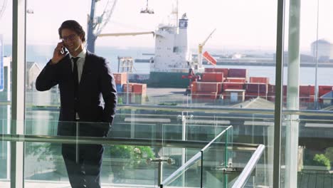 buisnessman using smartphone in modern office building