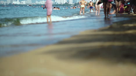 Crowd-of-Western-Tourist-on-a-private-hotel-seaside-beach-resort-in-South-East-Asia-enjoying-and-relaxing-in-the-hot-sun-sea-sand-vacation