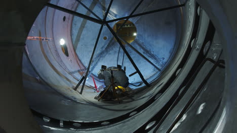 welding inside a large industrial tank