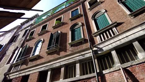 Typical-Brick-Wall-And-Windows-At-The-Ancient-Architecture-In-Venice,-Italy