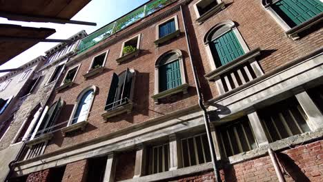 typical brick wall and windows at the ancient architecture in venice, italy