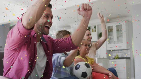 animation of confetti over happy caucasian family watching match in tv,