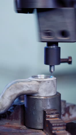 worker in factory using machine. professional worker on the factory working with machinery. vertical video