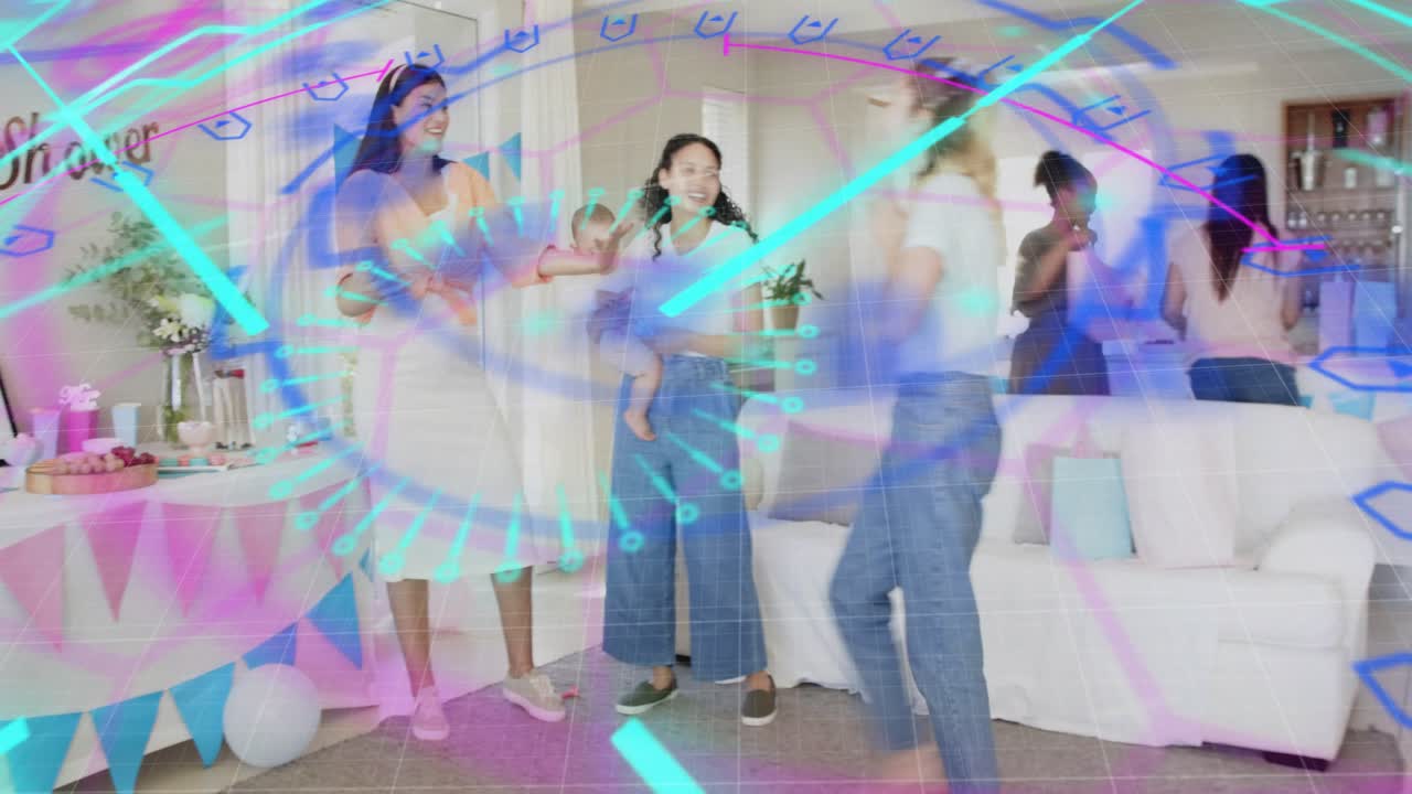 Blue purple digital overlay receding, revealing two women passing infant at baby shower table