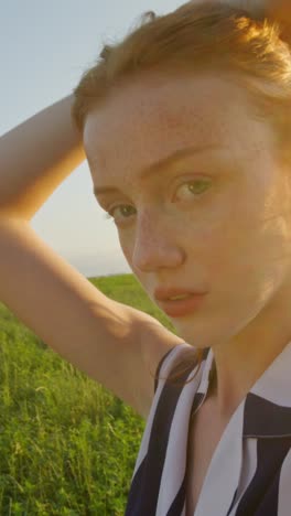 woman in a field at sunset