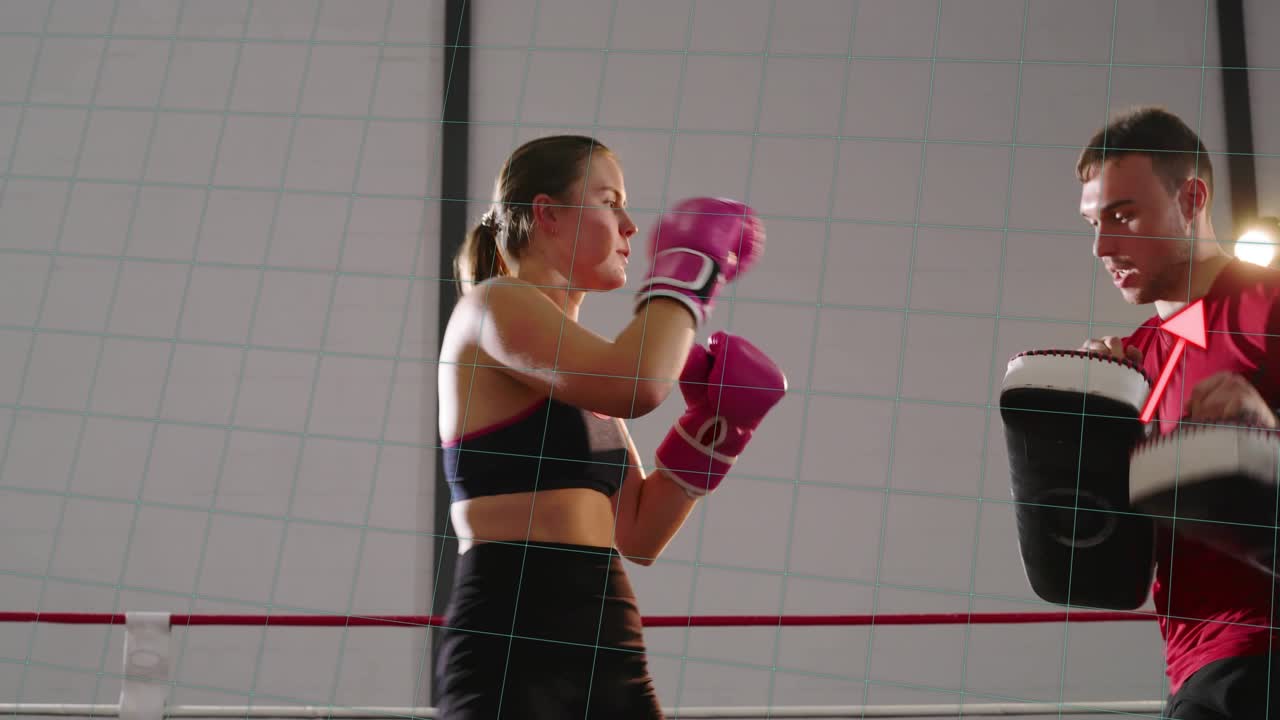 Female boxer stepping in and kicking pads, then throwing punches while red chart tracking training