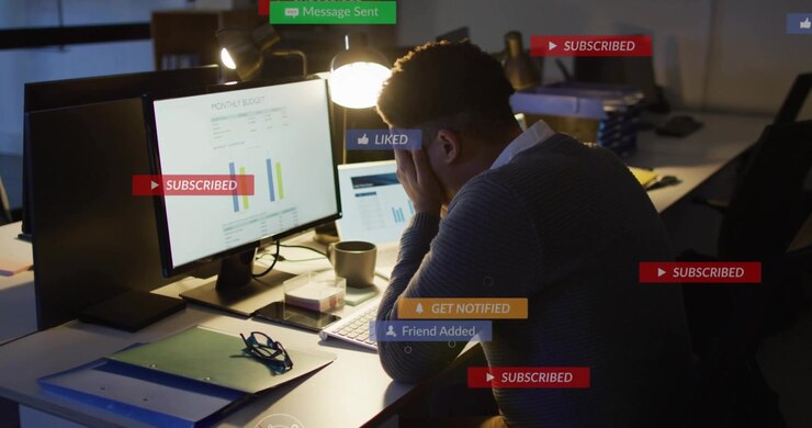 Male finance analyst leaning at desk, getting like alerts overlaying charts, rising then fading