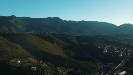 aerial view of a mountainous region with towns and roads