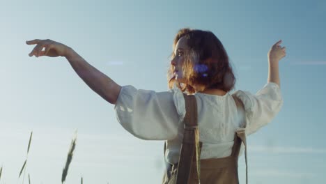 woman in a field at sunset