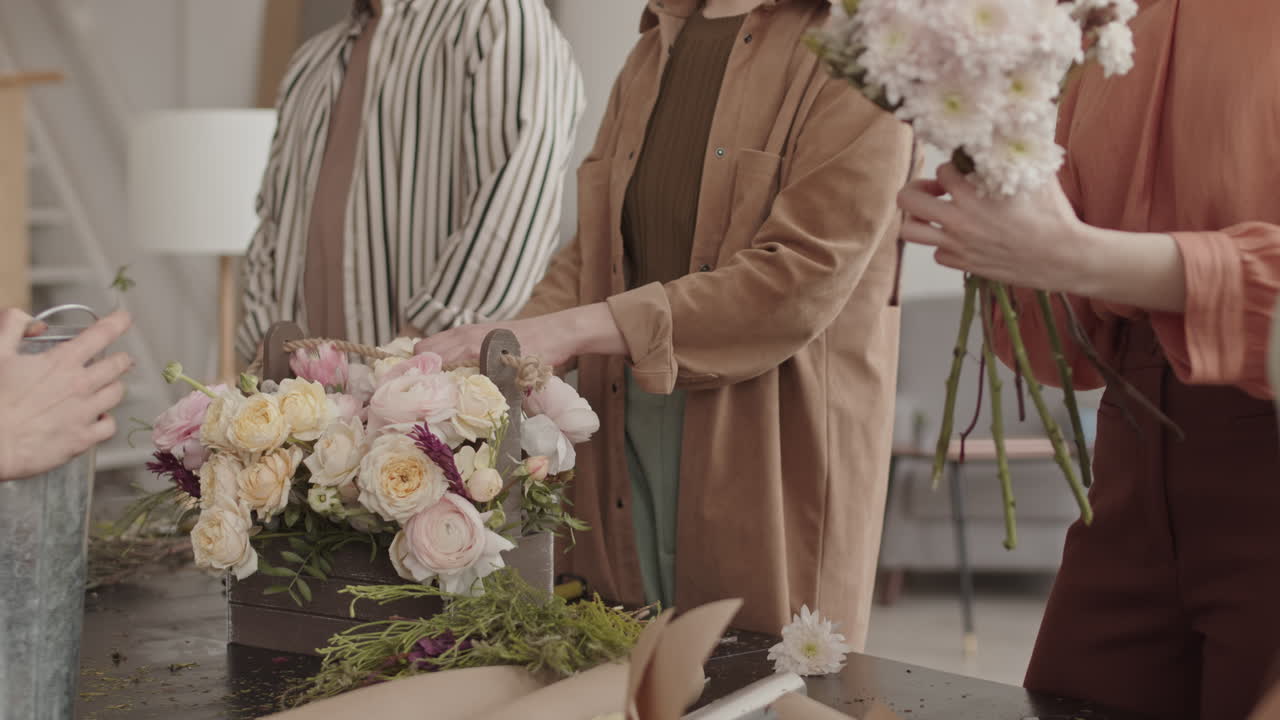Cropped Florists Working with Flower Composition