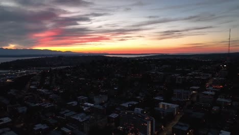 aerial view of the sun setting over seattle's queen anne neighborhood