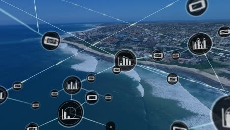 animación de iconos conectados sobre vista aérea del mar y el paisaje urbano moderno contra el cielo