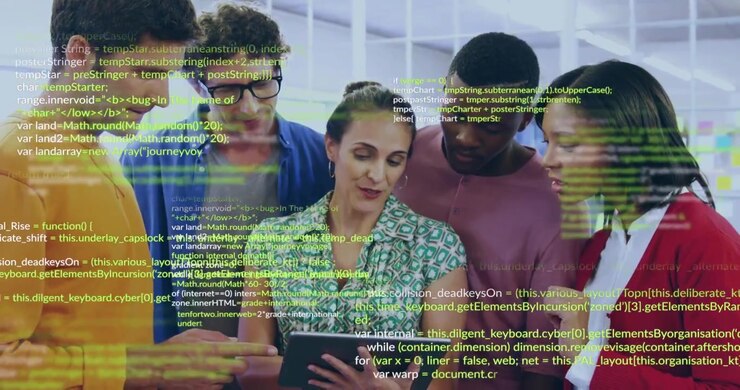 Team lead tapping tablet showing code as team leaning pointing reviewing software passing device