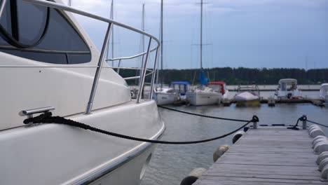 the moored boat swings on the waves