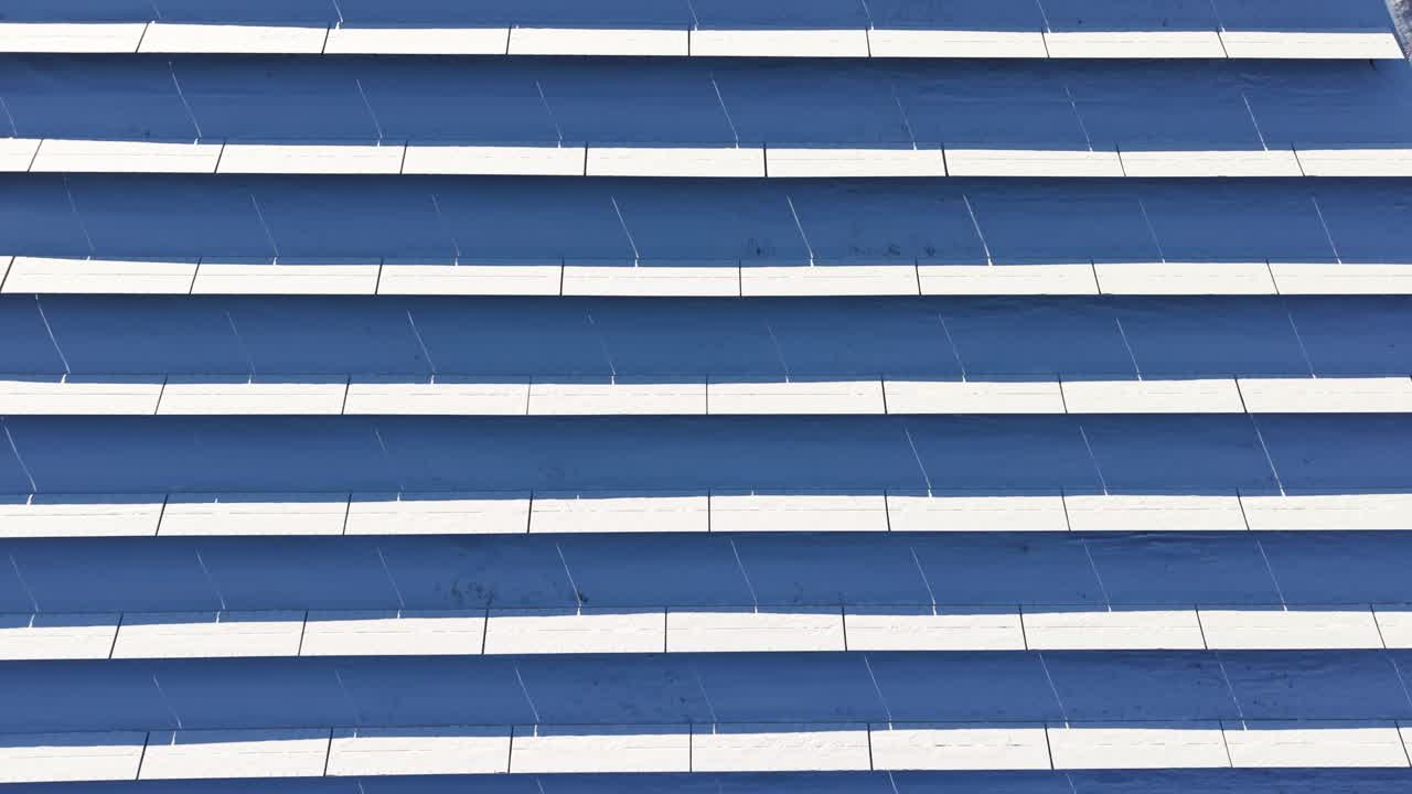 Close view of parallel solar panels covered with snow