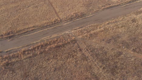 aerial shot showing ground surface of an old abandoned race track