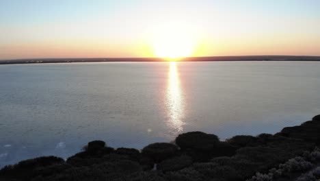 warm golden sunrise illuminated in tranquil seascape