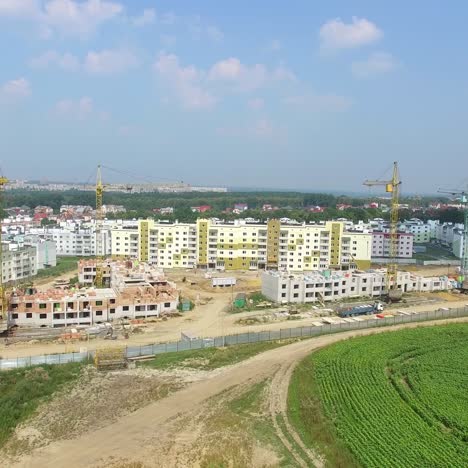 modern high-rise buildings are building on the outskirts of the city in the summer. aerial view