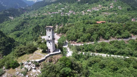 clock tower of prousos monastery in eyritania greece, aerial point of interest shot