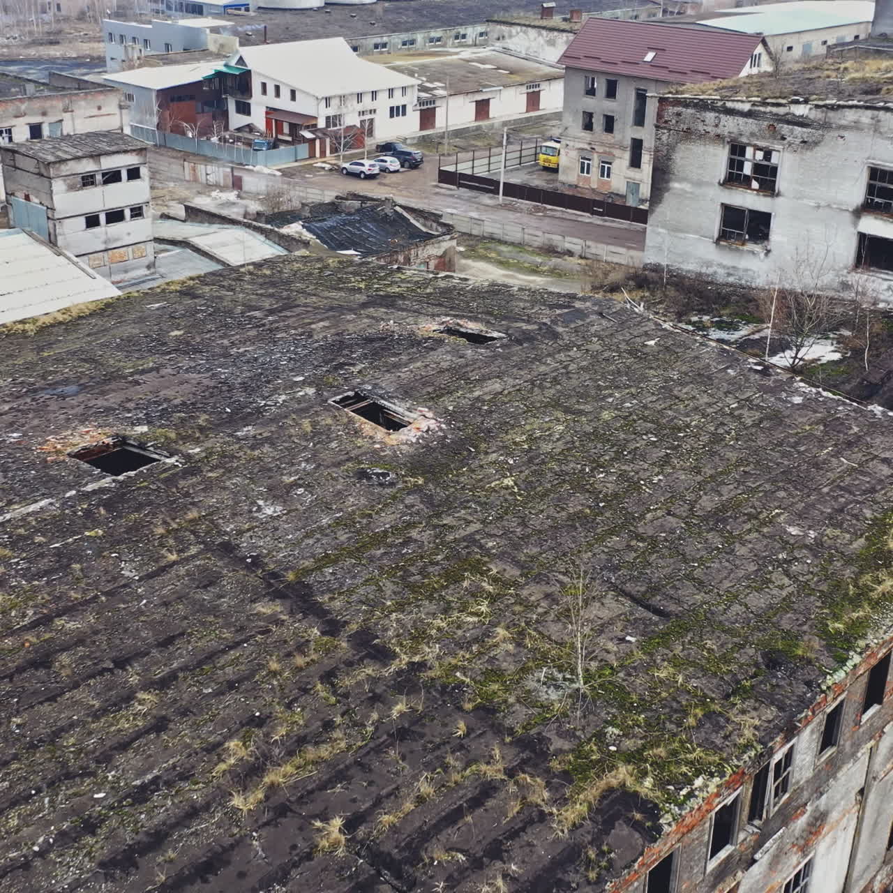 Flight over the destroyed factory. Old industrial building for demolition. Aerial view