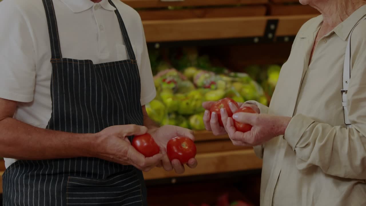 Manuel, Elena opening finance letter at stall, animated ticker on ledger weighing sale for pension