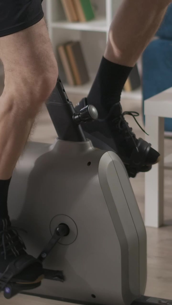 Close-Up of Person's Legs Pedaling on an Exercise Bike