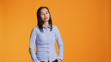 Portrait-of-carefree-asian-girl-posing-with-confidence