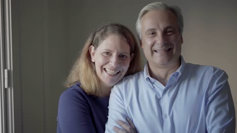 portrait of happy mid adult family couple