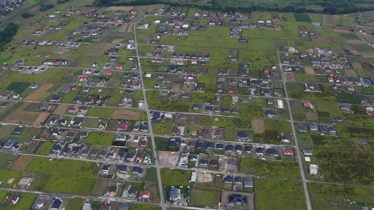 Aerial View of Eastern Europen Neighborhood With Scattered Houses and Fields