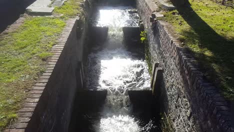 cascading water from an old mill in canterbury, kent