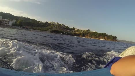 Traveling-with-a-boat-in-Skiathos-in-Greece,-boat-is-heading-to-the-next-destination-while-seagulls-following-us