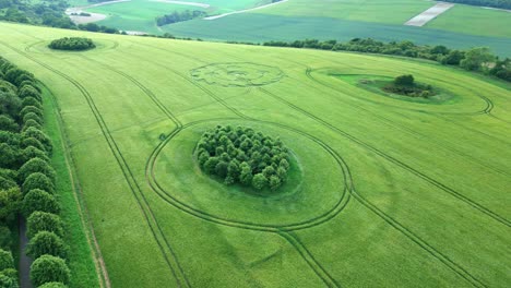 aerial view towards wiltshire mathematical crop circle formation in lush agricultural countryside meadow 2022