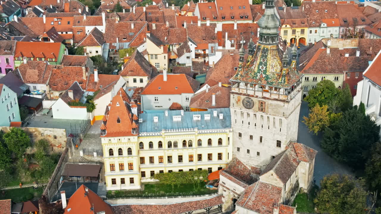 Aerial drone view of the Historic Centre of Sighisoara, Romania. Old buildings, narrow streets, Sighisoara Clock Tower