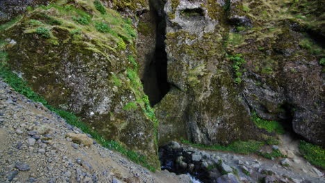 crevasse in mountains, snaefellsnes peninsula, iceland, medium shot tilt up