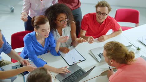 Successful-people-giving-high-five-indoors.-Creative-team-brainstorming-office