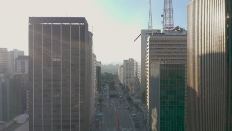 paulista avenue seen from above in são paulo, sp, brazil, sunset with clouds, forward movement between buildings