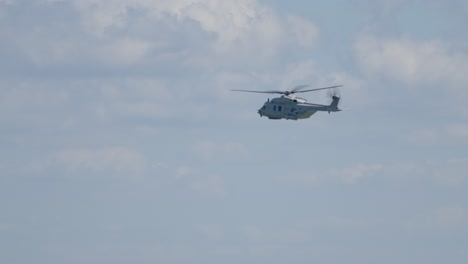 helicopter yawing, flying orbit - low angle, sunny day